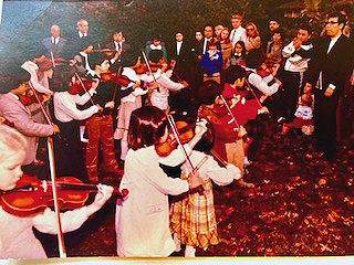 group of young students playing violin 1983