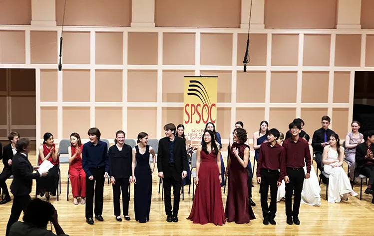 Lyra and Raemonia students on stage receiving award