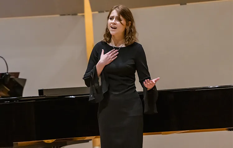 Anna Edwards sings onstage.