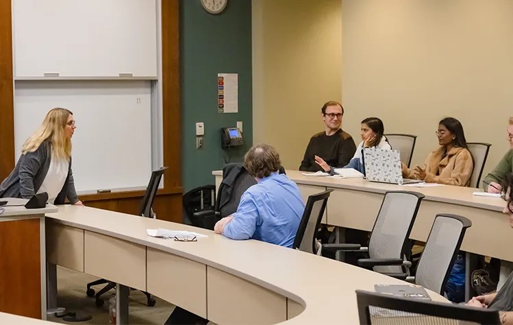 Students participating in the workshop and engage with Gina Jensen in the discussion.
