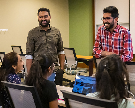 Student talking and laughing together