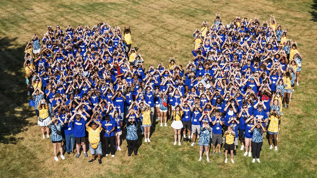 Webster students in a W formation on campus