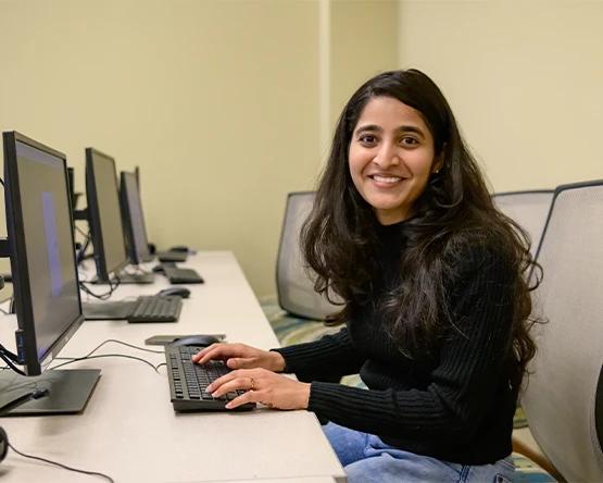 A graduate student working in their class.