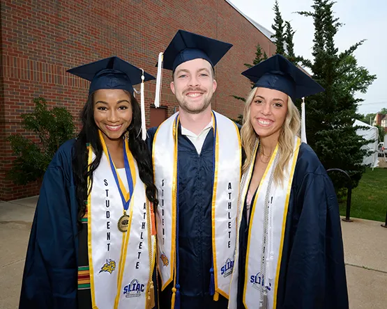 A group of smiling Webster grads.
