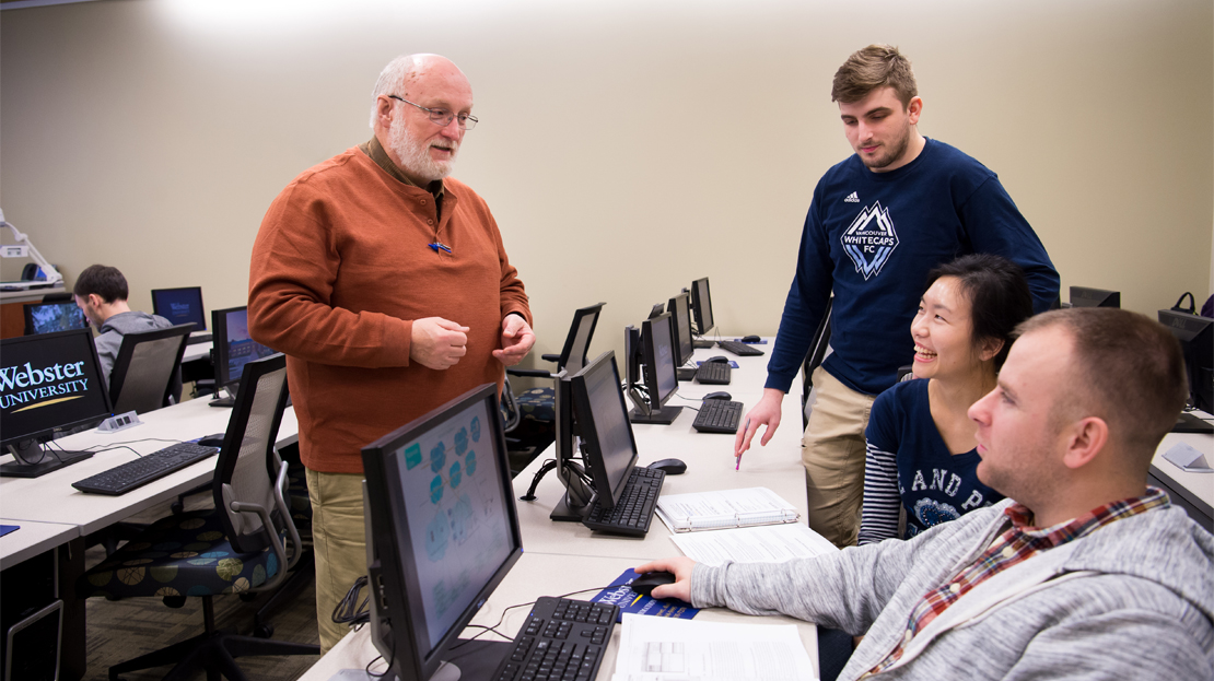 A group of students working with an instructor.