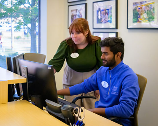 Two Webster employees working in the Career Planning and Development Center