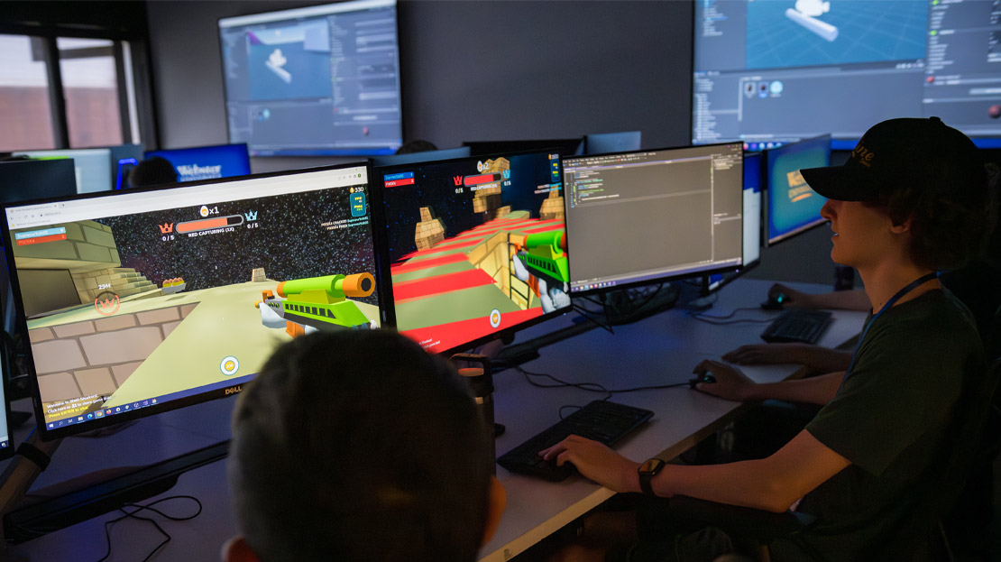 Two students designing a computer game.