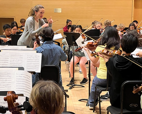 conductor with orchestra