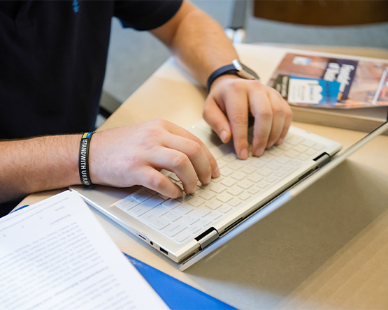 A Webster Student attending class.