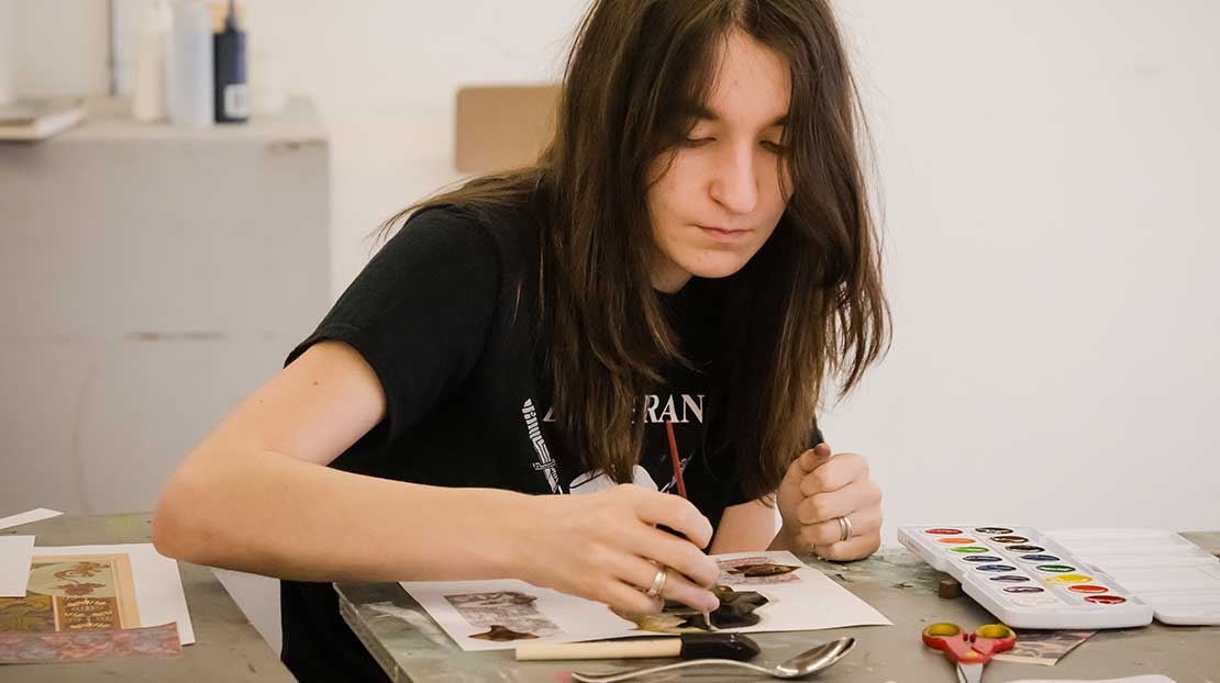 Student making art