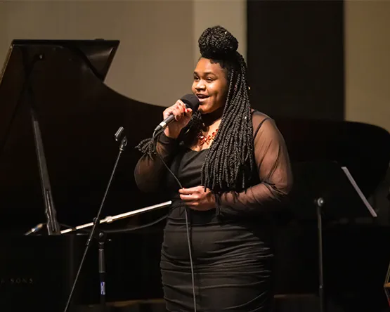 A student vocalist performs.