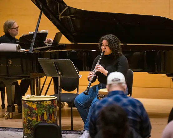 Student performs on clarinet accompanied on piano