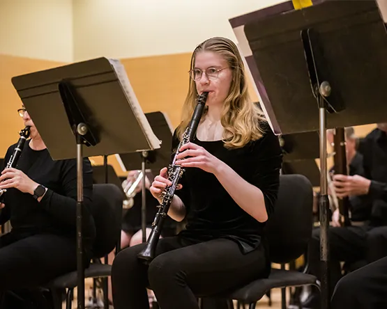 A student performs on clarinet in the wind ensemble.