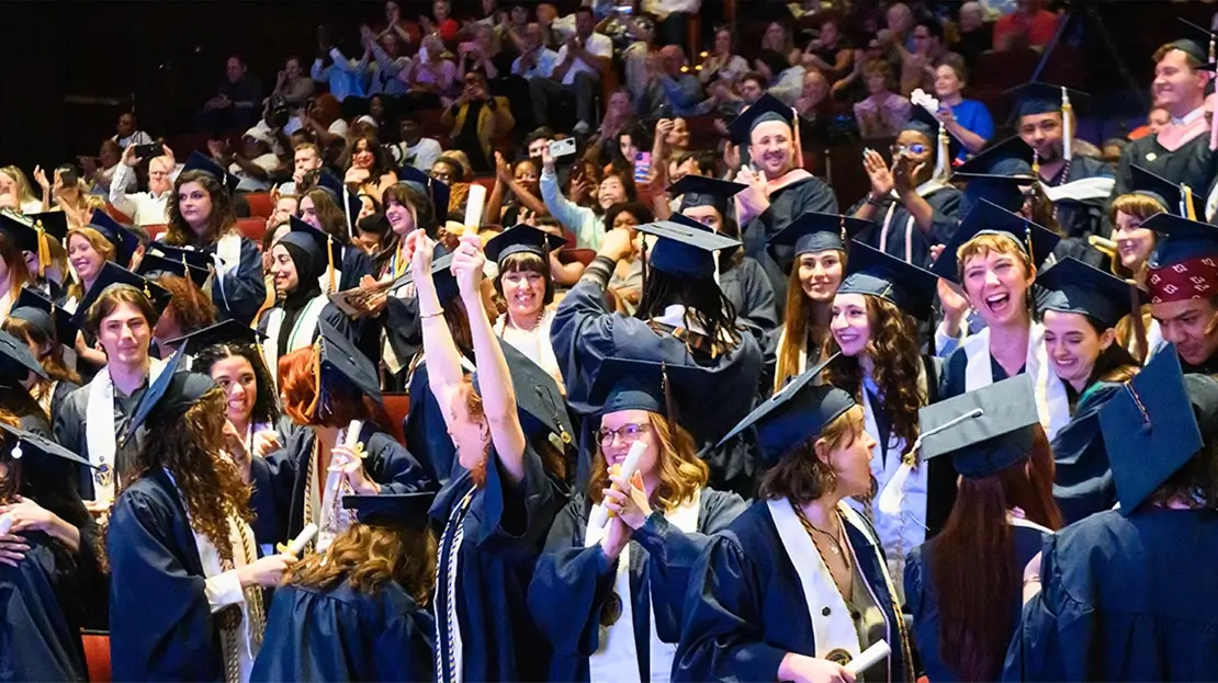 A large group of Webster students celebrating at their Graduation Ceremony.