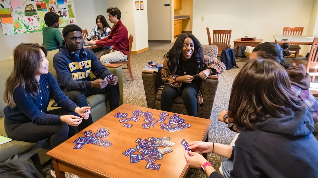 group of friends play game in dorm lobby