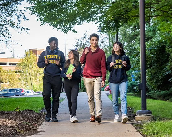 A group of students walking together on campus.